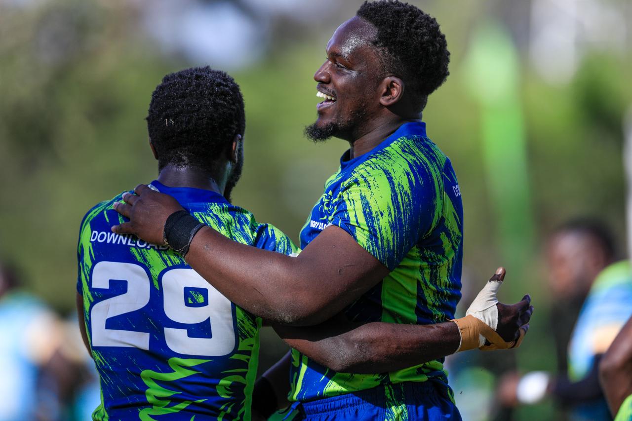 Rugby players contesting a tackle during a Kenyan club match